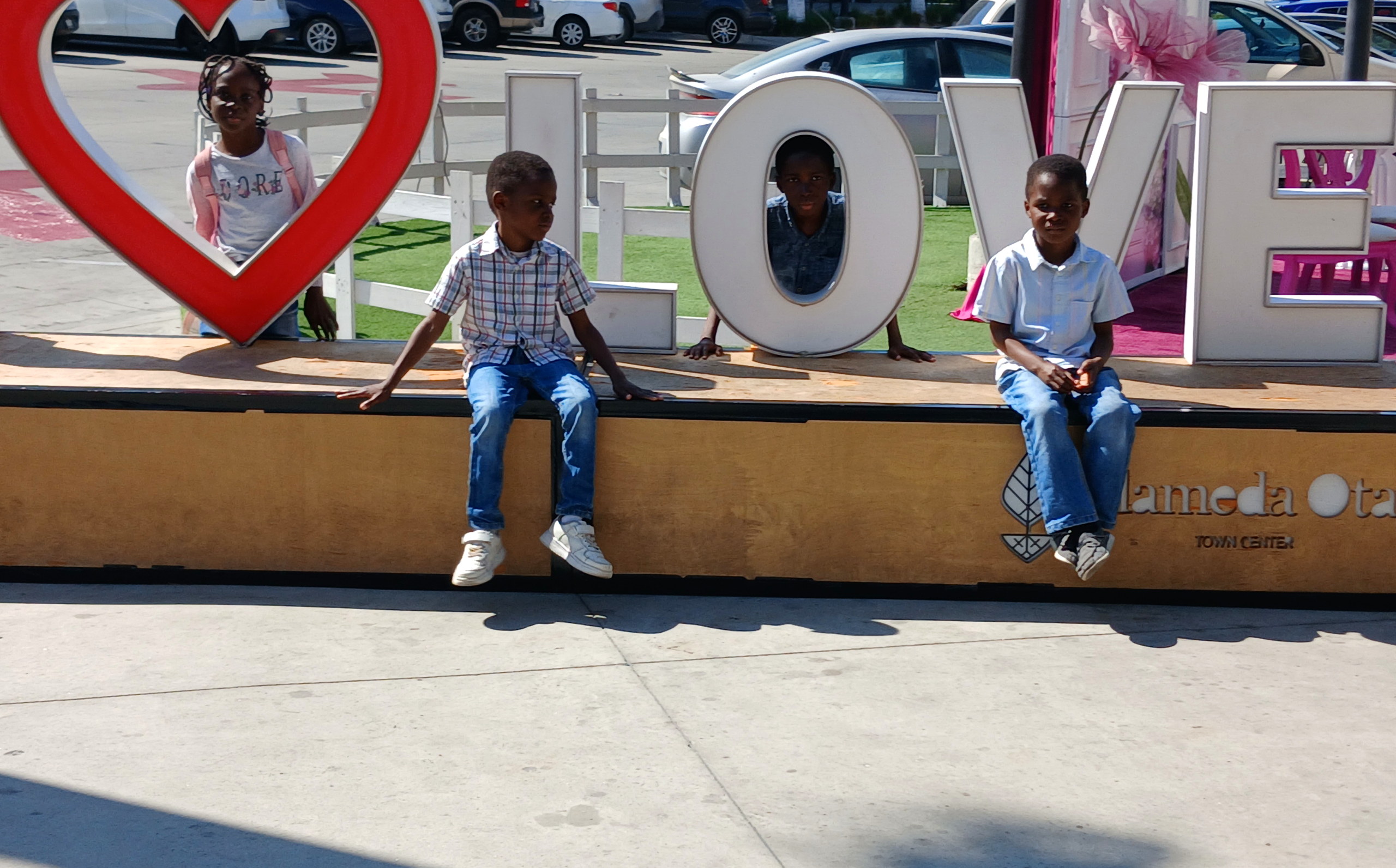 Our children playing on a giant LOVE sign